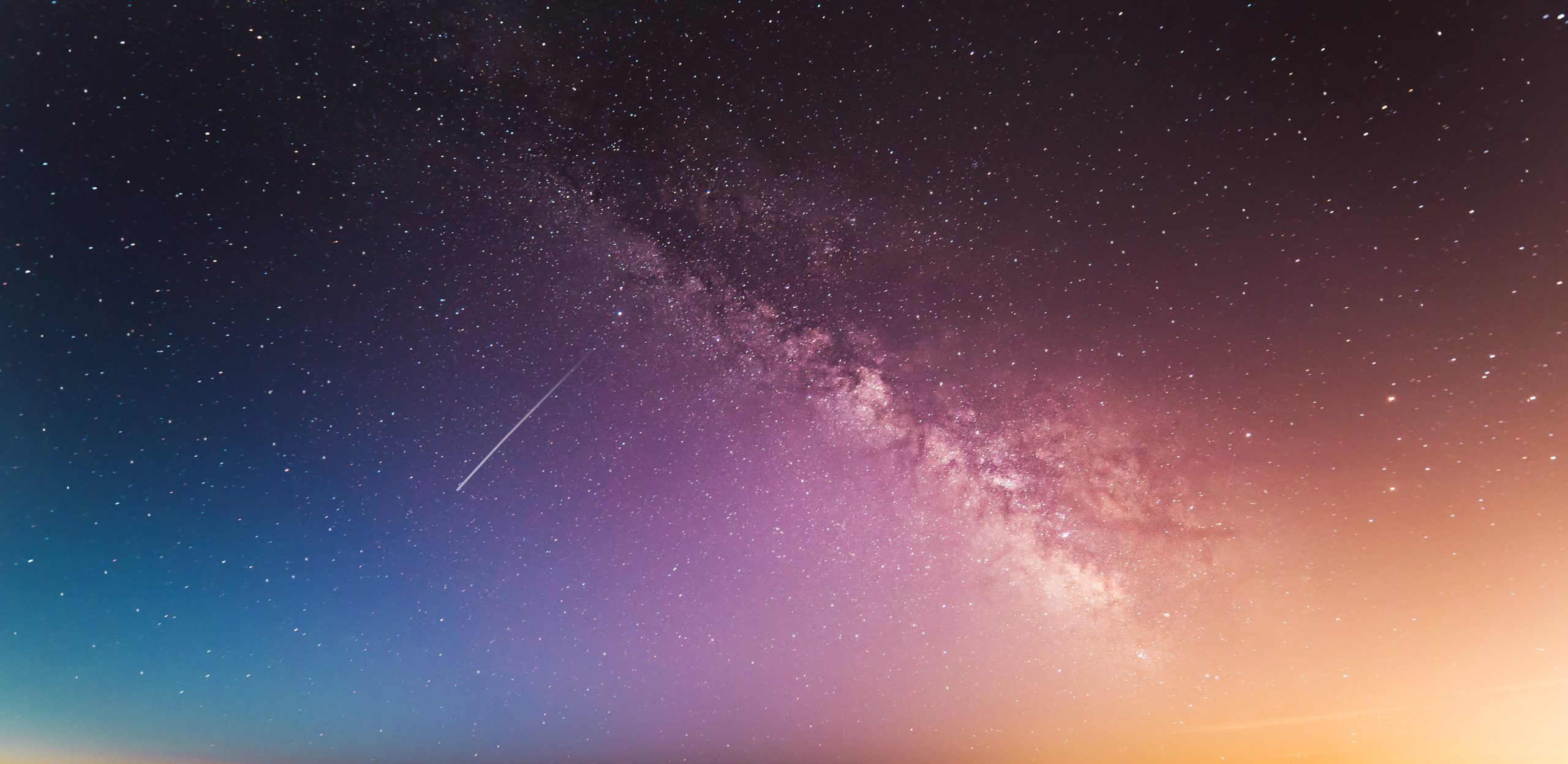 milky way above body of water